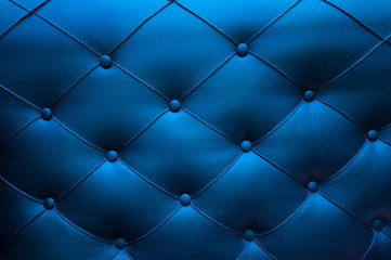 Blue leather texture on the sofa with buttons
