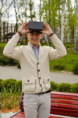 Young man in virtual glasses