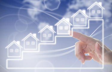 Hand clicking on house symbol