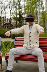 Fototapeta premium Young man in virtual glasses