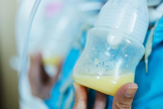 Woman Pumped Breast Milk From The Breast.