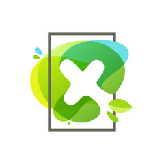 X letter logo in square frame at green watercolor splash backgro