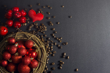 decor ball in the vine,coffee beans, cherry, red heart on the black ground