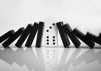 Dominoes on light background