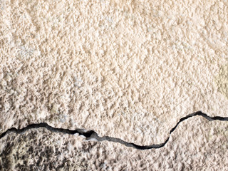 Background texture of beige gold plaster walls.