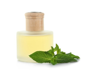 Essential oil with mint on white background