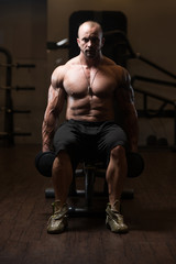 Fototapeta na wymiar Bodybuilder Resting At The Bench
