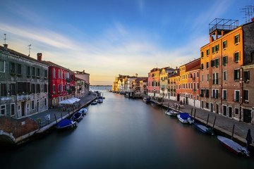 Obraz premium Sunset in Venice. Long exposure from a bridge. Explosion of colors.
