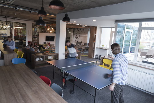 playing ping pong tennis at creative office space