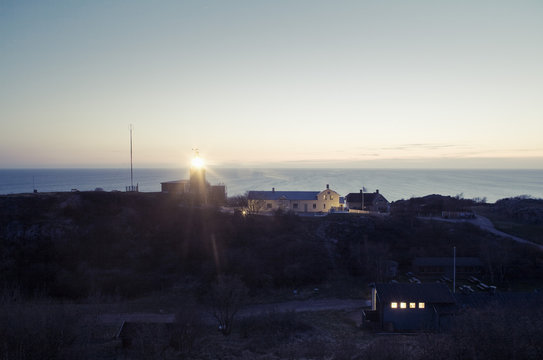 Illuminated Kullen Lighthouse at sunset