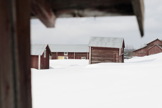 Houses on snow covered field