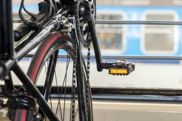 Photo sur Plexiglas Vélo Detail bicycle standing in a bike stand in a train