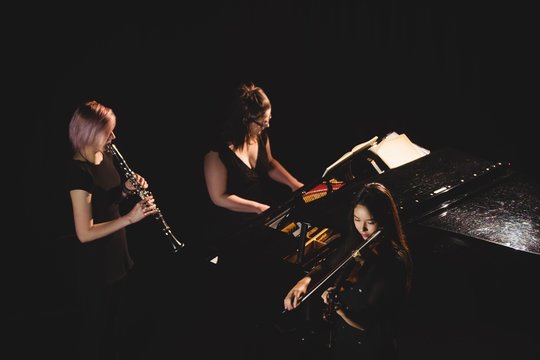 Women playing various instrument
