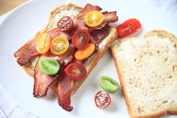 Overhead of bacon and cherry tomato sandwich 