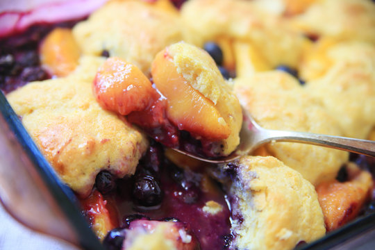 Serving Up Peach And Blueberry Cobbler