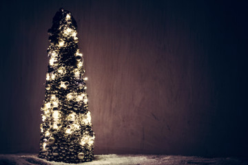 Christmas tree ornament wrapped with lights.