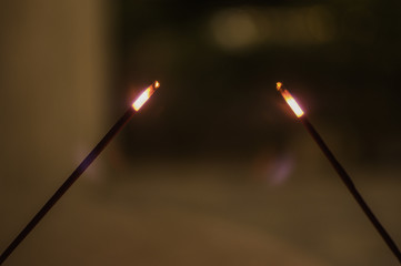 Burning sticks at night