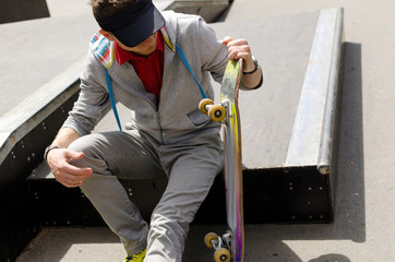 Young man with the skateboard 