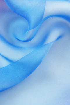 drapery folds transparent blue fabric  with copy space