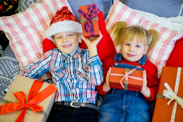 boy and girl give Christmas gift