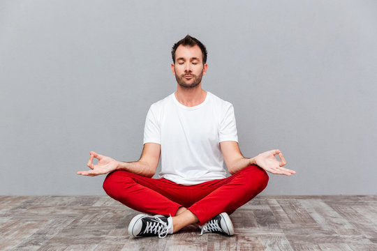 Man In Casual Cloth Sitting In Lotus Position