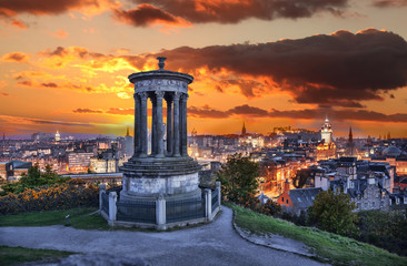Fototapeta premium Edinburgh against sunset with Calton Hill in Scotland