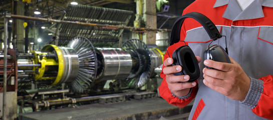 Worker with protective headphone