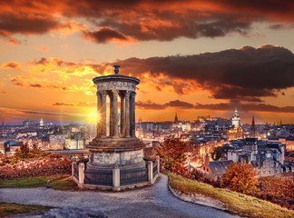 Edinburgh with Calton Hill against autumn leaves in Scotland