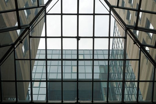 Glass roof with metal beams of an office building