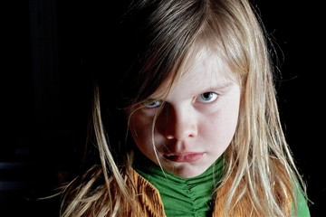 angry looking little girl