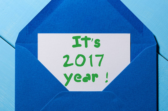 It's 2017 year - inspiration letter in blue envelope. Happy New Years and Christmas background