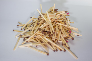 A pile of unburned matchsticks on white background 