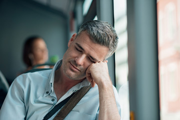 Man sleeping on the bus - obrazy, fototapety, plakaty