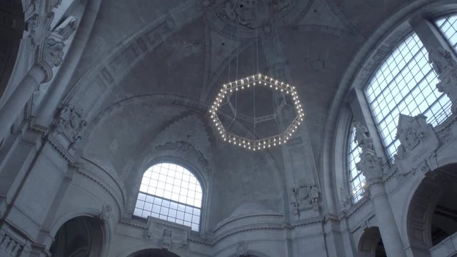New Town Hall in Hanover, Germany. Tilt to the ceiling of the dome with it's dome lamp in 4K and S-Log3. Long shot. Autumn. Neues Rathaus Hannover.