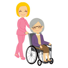 Senior patient woman in wheelchair with beautiful young nurse