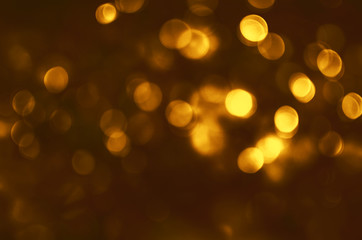 Abstract holiday gold background, beautiful shiny Christmas ligh