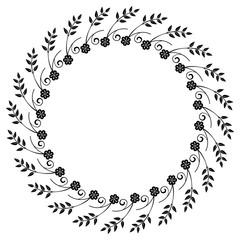 Black and white round frame with floral silhouettes. 