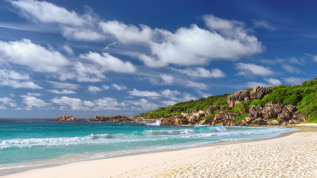 Grand Anse beach on La Digue island in Seychelles. Fashion travel and tropical beach concept. © lucky-photo