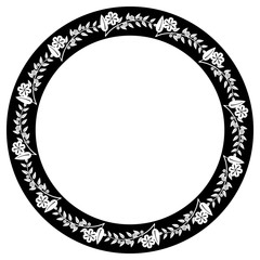 Black and white round frame with floral silhouettes. 