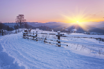 Fantastic evening winter landscape. Dramatic overcast sky. Creative collage. Beauty world.