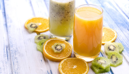 Fresh orange and kiwi  juice in glass Copy space