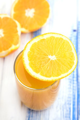Fresh orange juice in glass Top view