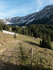 Alpine trail with view on mountains in autumn