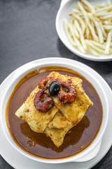 francesinha traditional meat cheese spicy sauce grilled sandwich