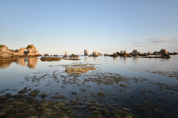 beautiful rocks forms on the sea at sunset time with blue sky on sunset time