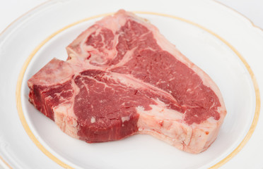 T-bone steak in a rustic plate