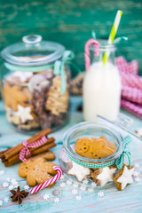 Obraz na płótnie Canvas Delicious homemade Christmas cookies and milk in glass jar. 