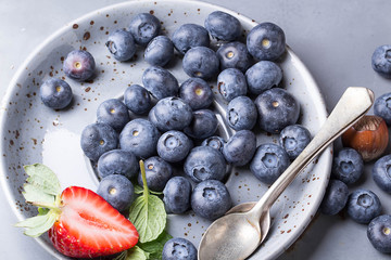 Strawberries and Blueberries on metal background