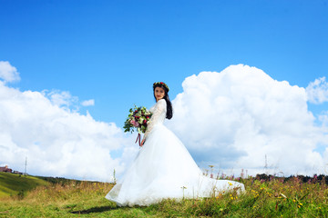 Beautiful bride in the mountains. The concept of marriage 