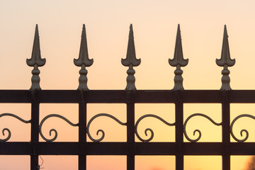 metal fence at sunset